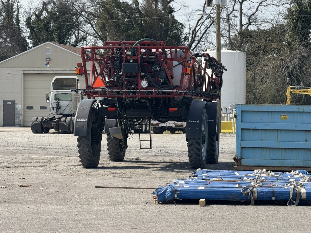 Case IH self-propelled agricultural sprayer staged for oversize move
