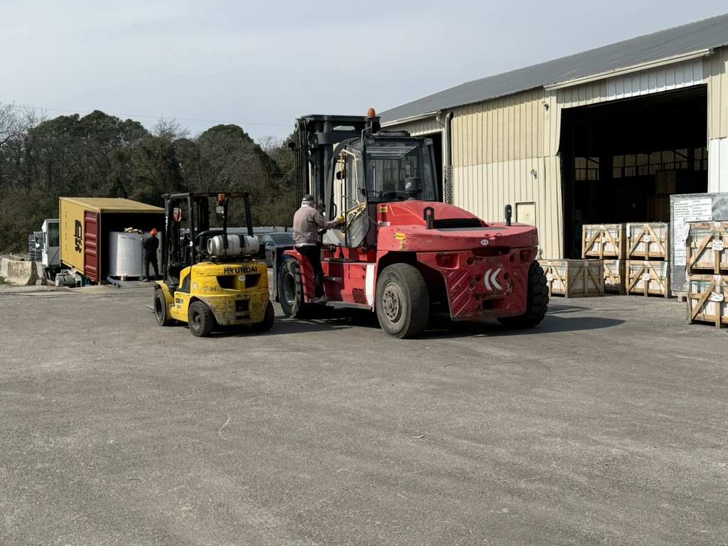 Heavy-capacity forklift loading a container at Carroll's Chesapeake facility