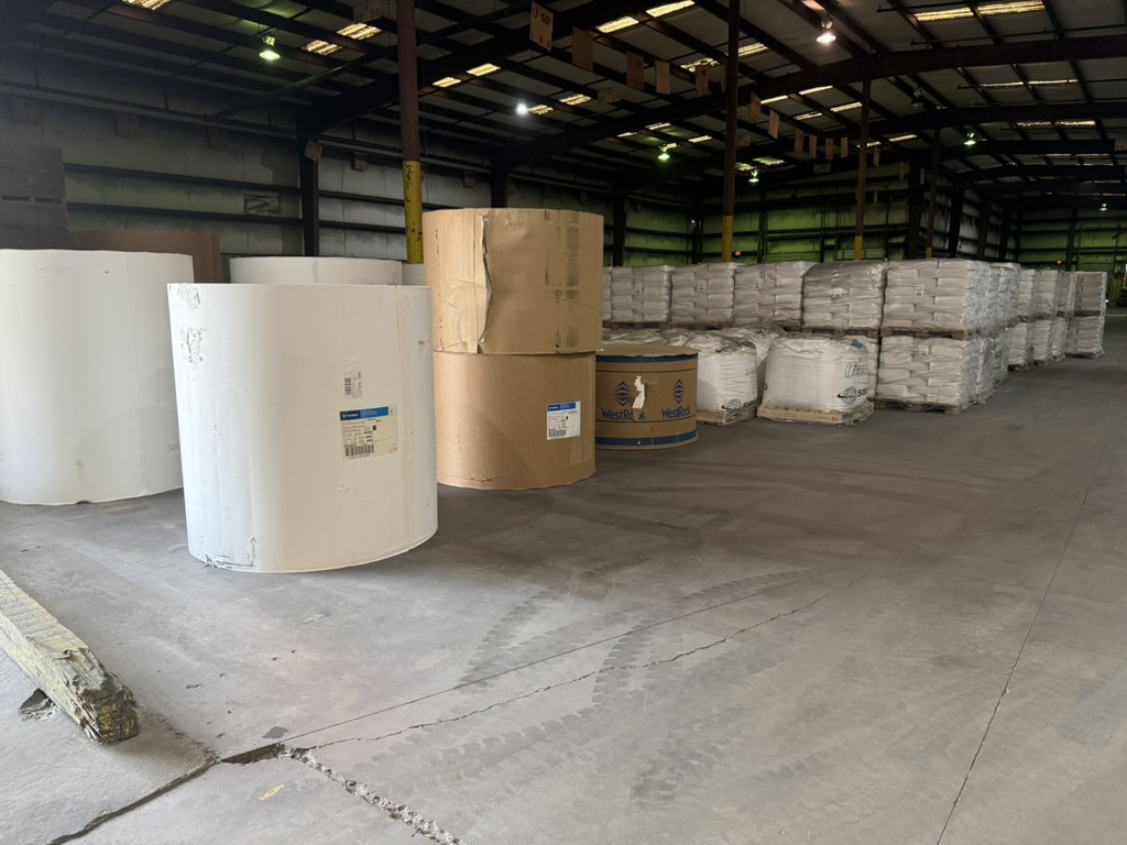WestRock paper rolls and super-sack pallets staged for outbound transload